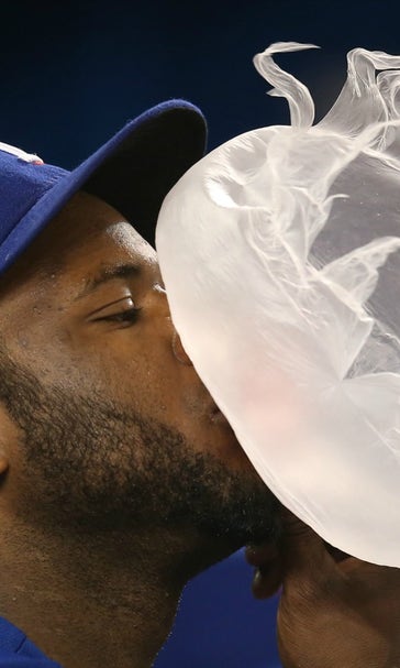 Look at this mesmerizing photo of a bubble exploding on a Rangers shortstop's face